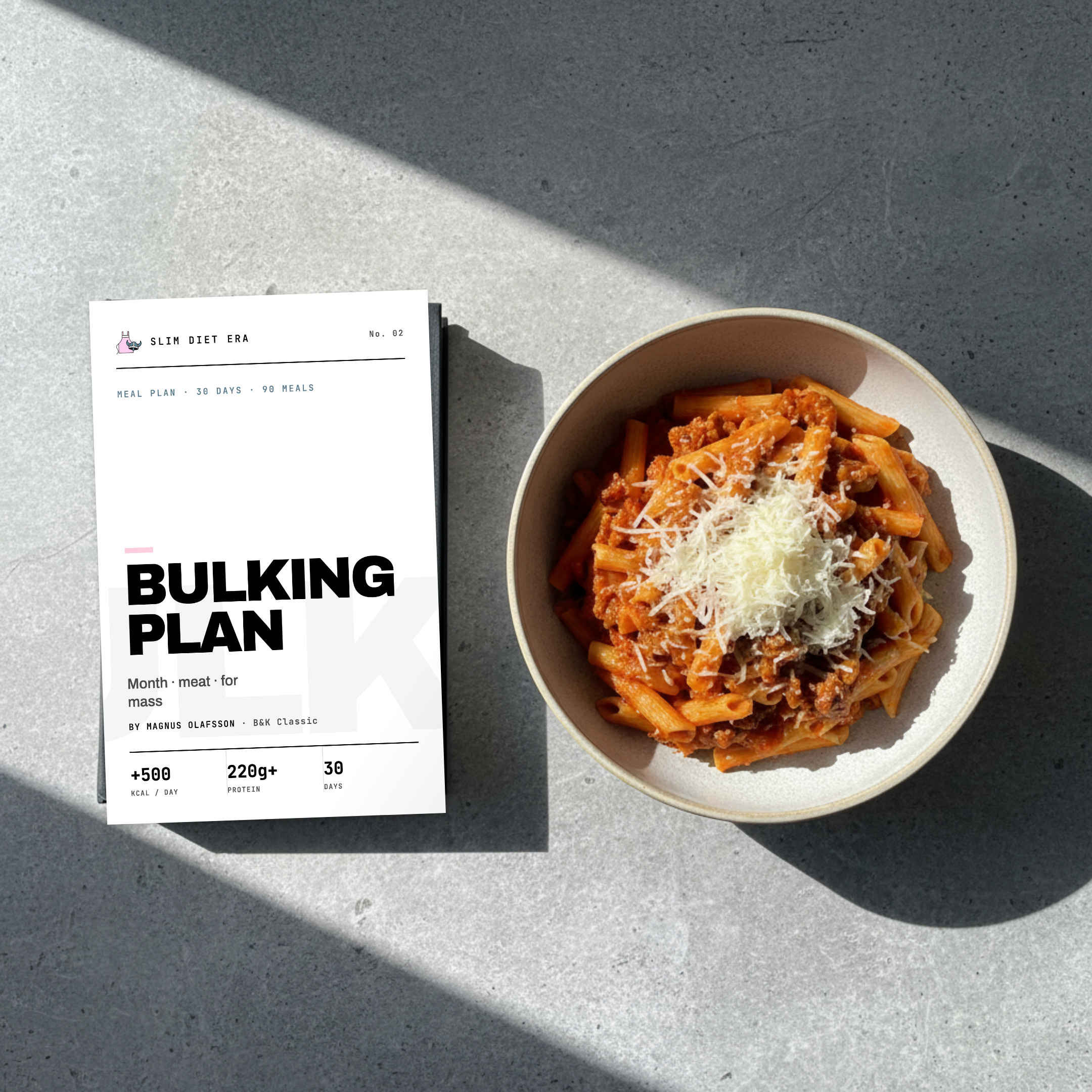 The Month Bulking plan shown as a printed Slim Diet Era booklet — thirty days of growing food with macros inside